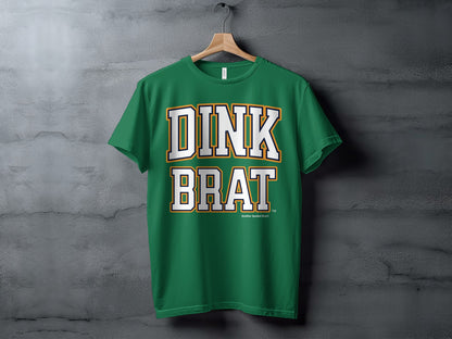 Green t-shirt with white and orange "DINK BRAT" text.