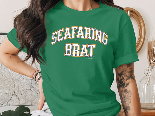 Green t-shirt featuring "SEAFARING BRAT" text with smaller text below.