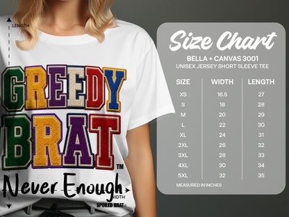 White t-shirt with "GREEDY BRAT" embroidered lettering and "Never Enough" text. Includes size chart information.