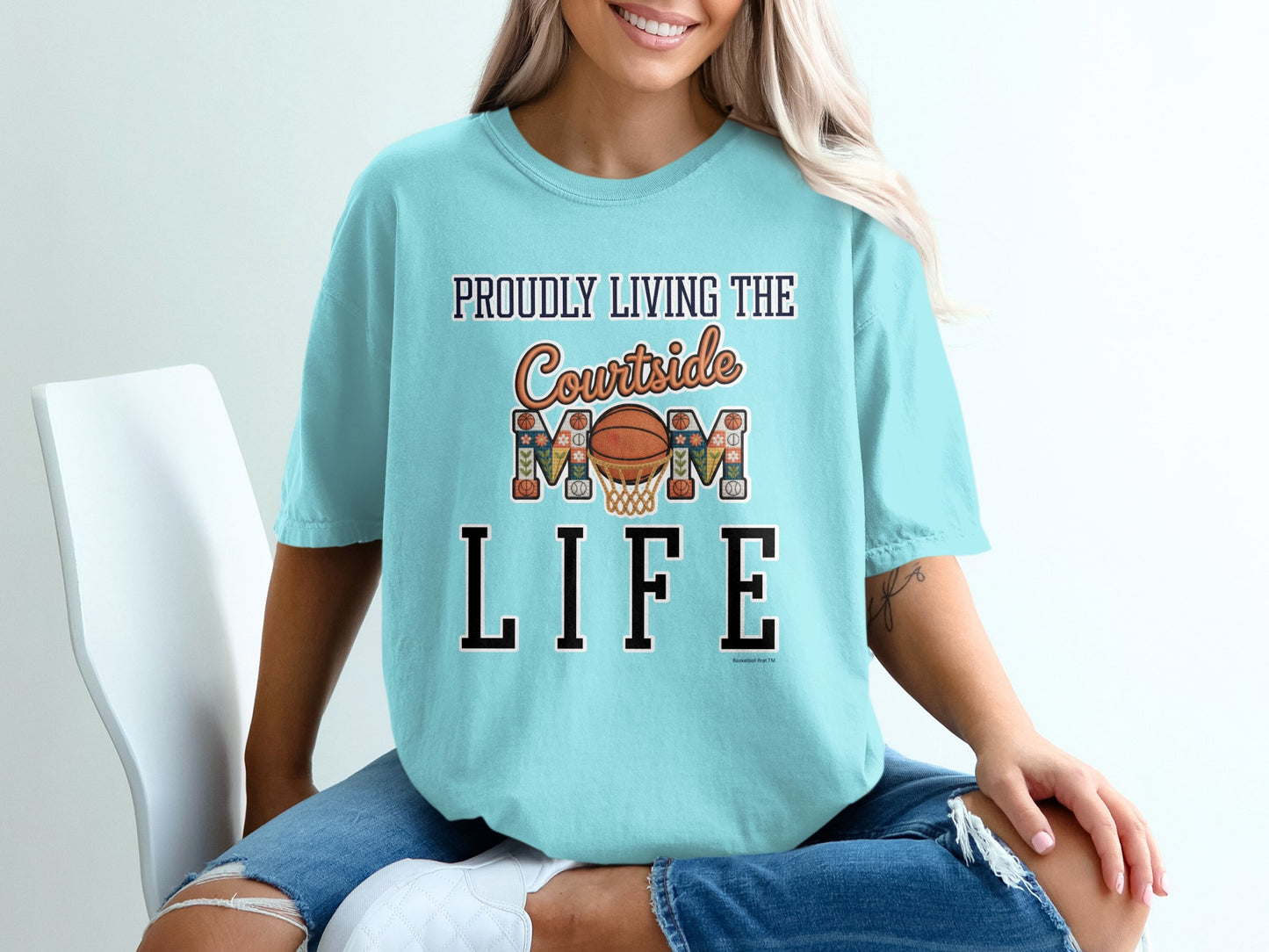 Teal t-shirt with "Proudly Living the Mom Life" basketball graphic.