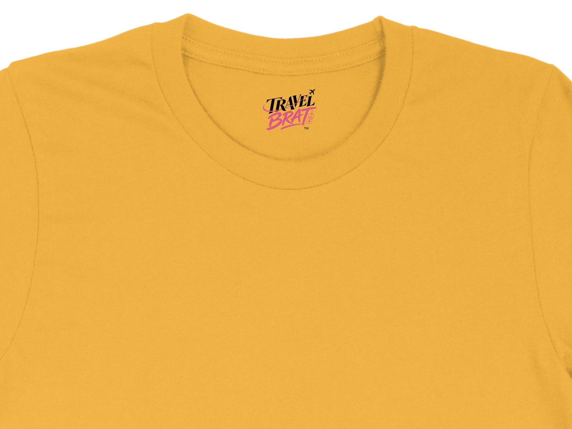Yellow t-shirt with 'Travel Brat' logo printed on the neckline.