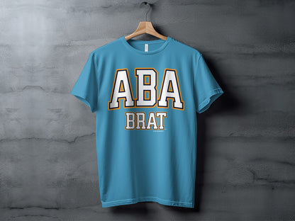 Blue t-shirt with "ABA BRAT" text in white with orange and navy trim.