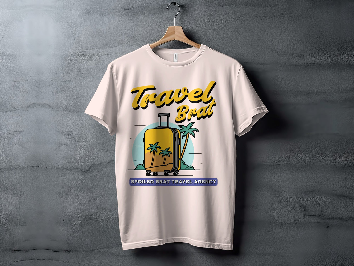 White t-shirt with yellow text "Travel Brat" and a graphic of a suitcase and palm trees.