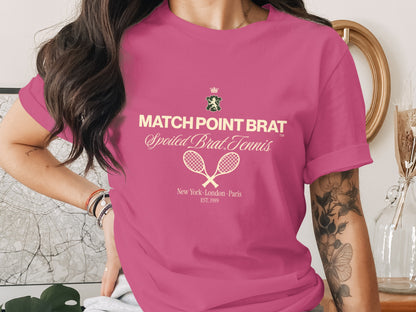 Pink t-shirt with "MATCH POINT BRAT Spoiled Brat Tennis" and tennis rackets.