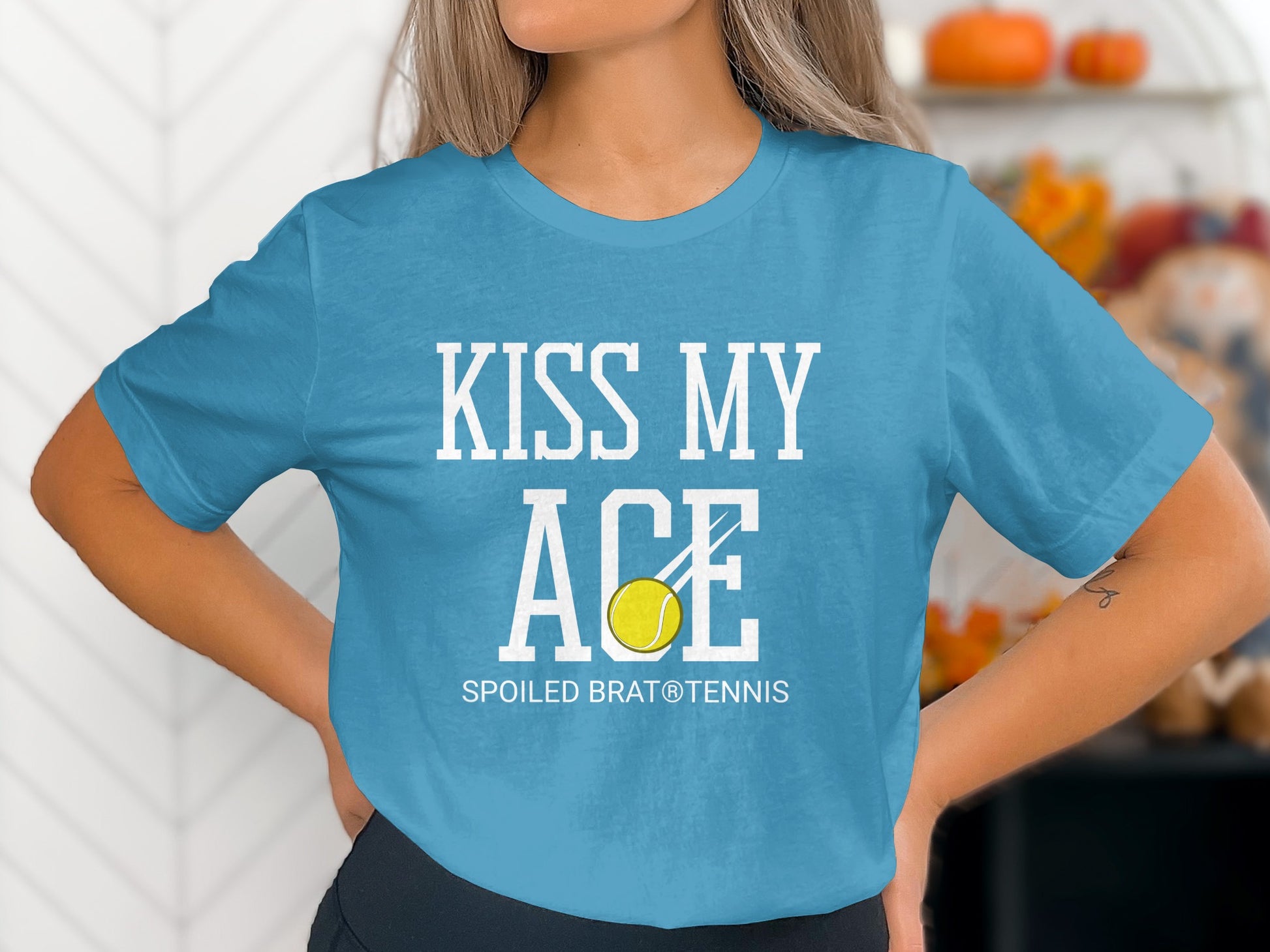 Teal t-shirt with "KISS MY ACE" and a tennis ball graphic.