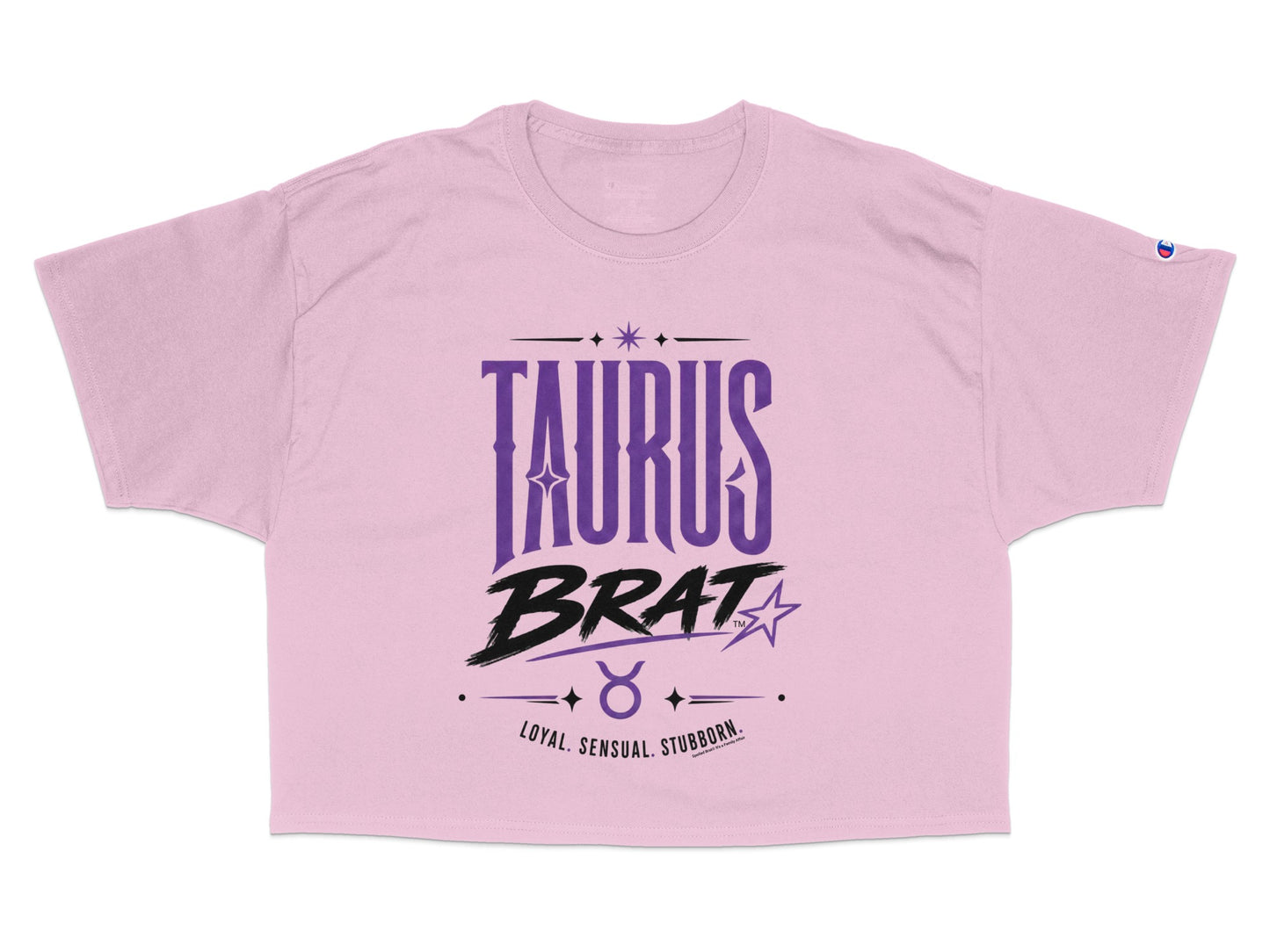Pink cropped t-shirt with "TAURUS BRAT" and zodiac symbol text.