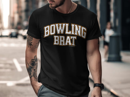 Black t-shirt with "BOWLING BRAT" text in yellow and white collegiate lettering.