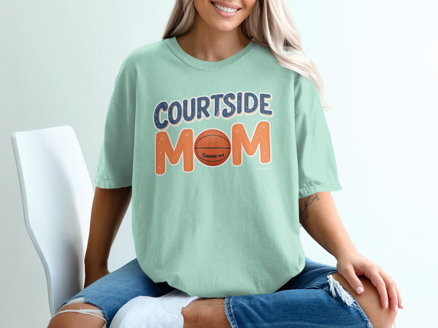 Light teal t-shirt with "Courtside Mom" and a basketball graphic.