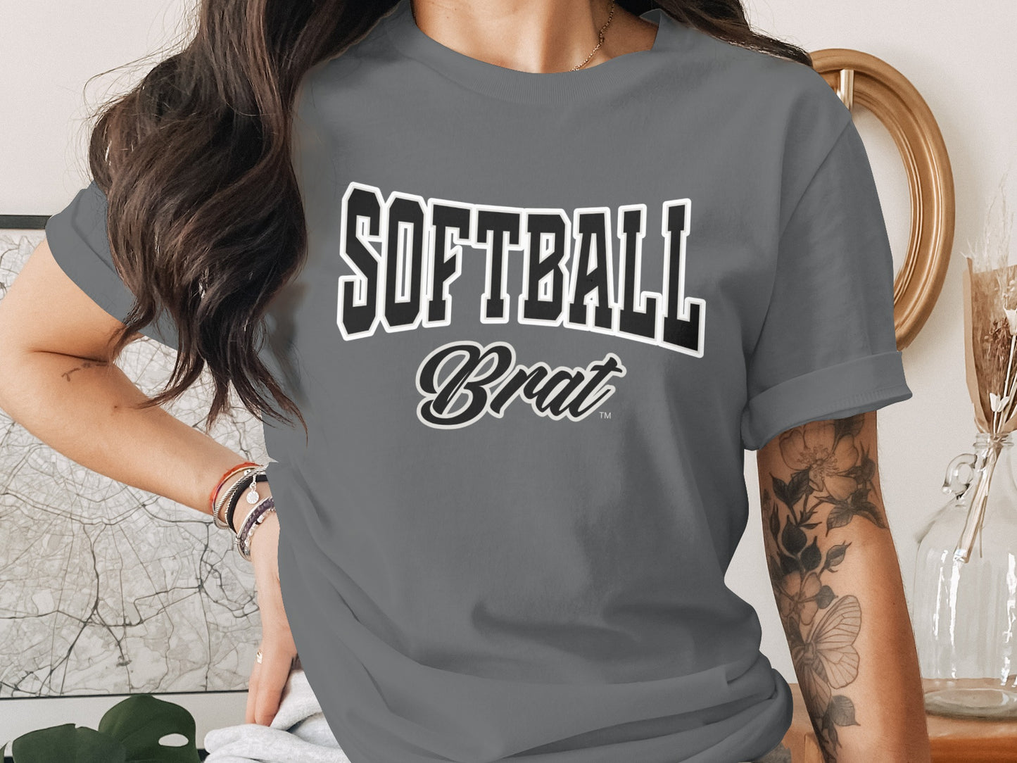Grey t-shirt with "SOFTBALL Brat" text in black and white athletic font.