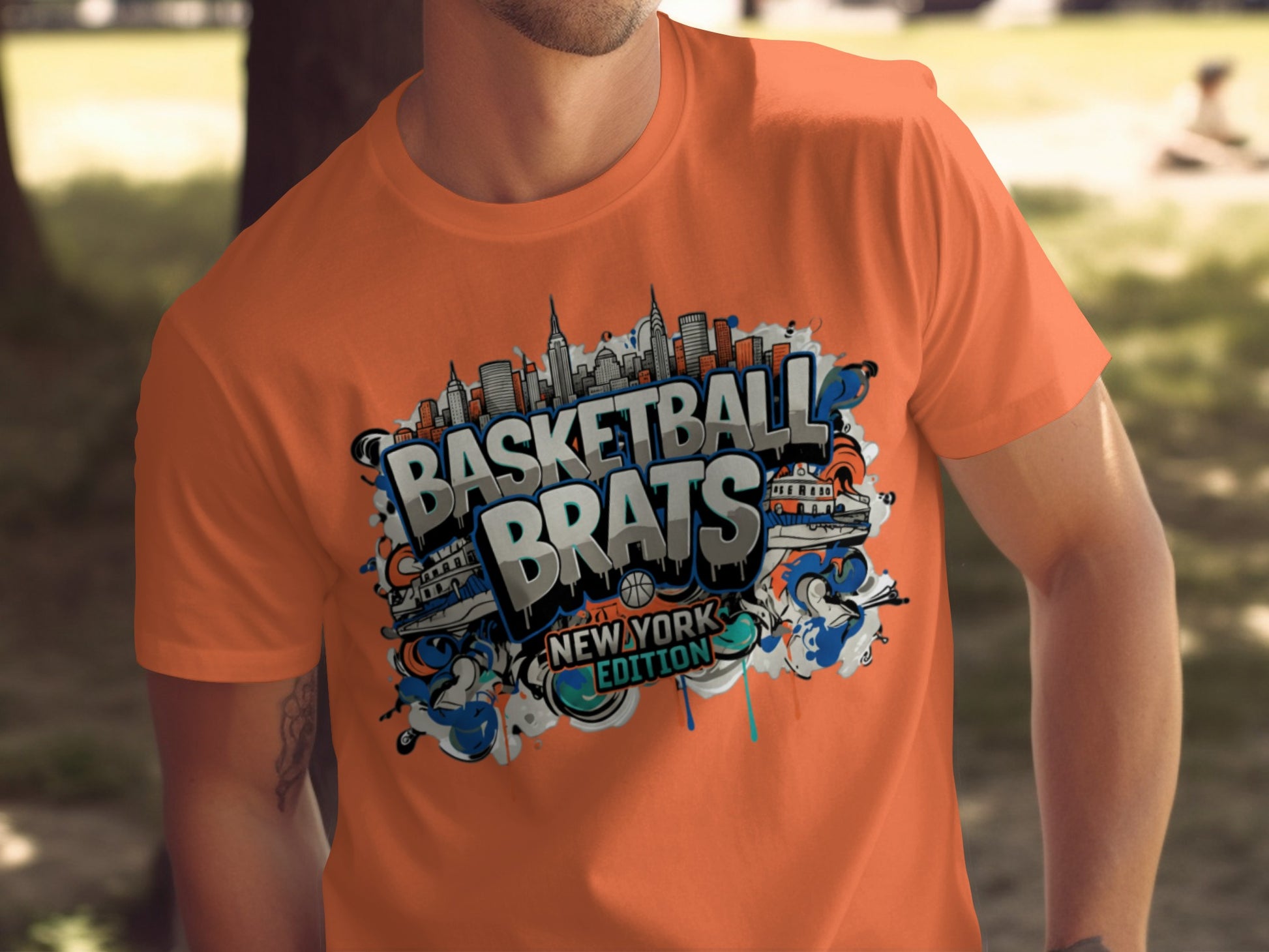 Orange t-shirt with "Basketball Brats New York Edition" graphic and graffiti elements.