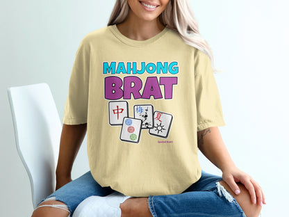 Yellow t-shirt with "Mahjong Brat" text and Mahjong tiles.