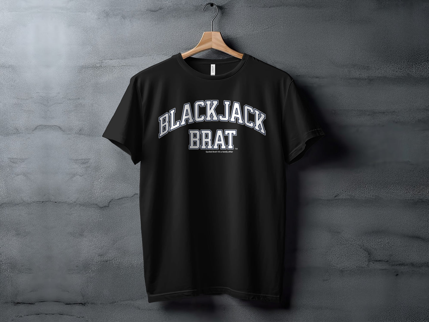 Black t-shirt with white "BLACKJACK BRAT" text and smaller text below.