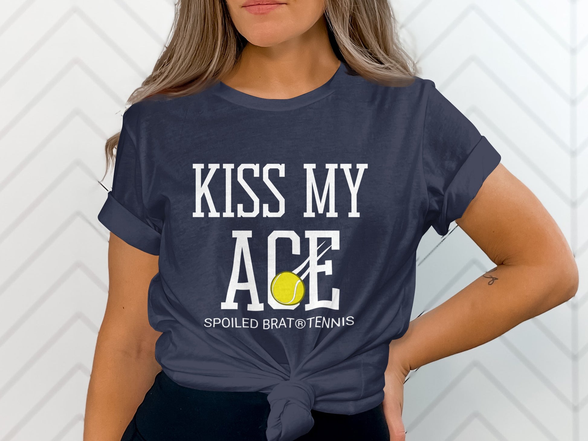 Navy t-shirt with "KISS MY ACE" and tennis ball graphic.