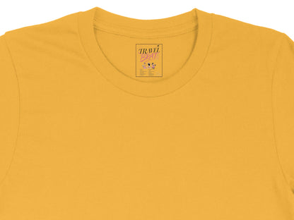 Yellow t-shirt tag with "TRAVEL BRAT" text and city list.
