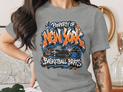 Gray t-shirt with "Property of NEW YORK BASKETBALL BRATS" graffiti art.