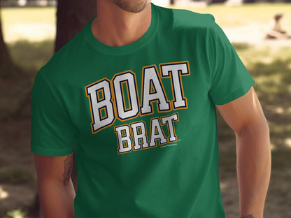 Green t-shirt with "BOAT BRAT" in white and gold outlined text.