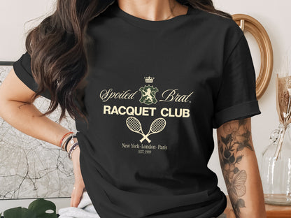 Black t-shirt with "Spoiled Brat Racquet Club" logo and "New York-London-Paris EST. 1989" text.