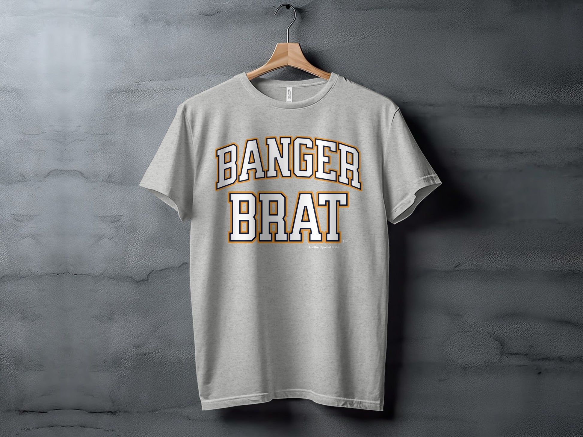 Light gray t-shirt with "BANGER BRAT" text in white and orange athletic font.