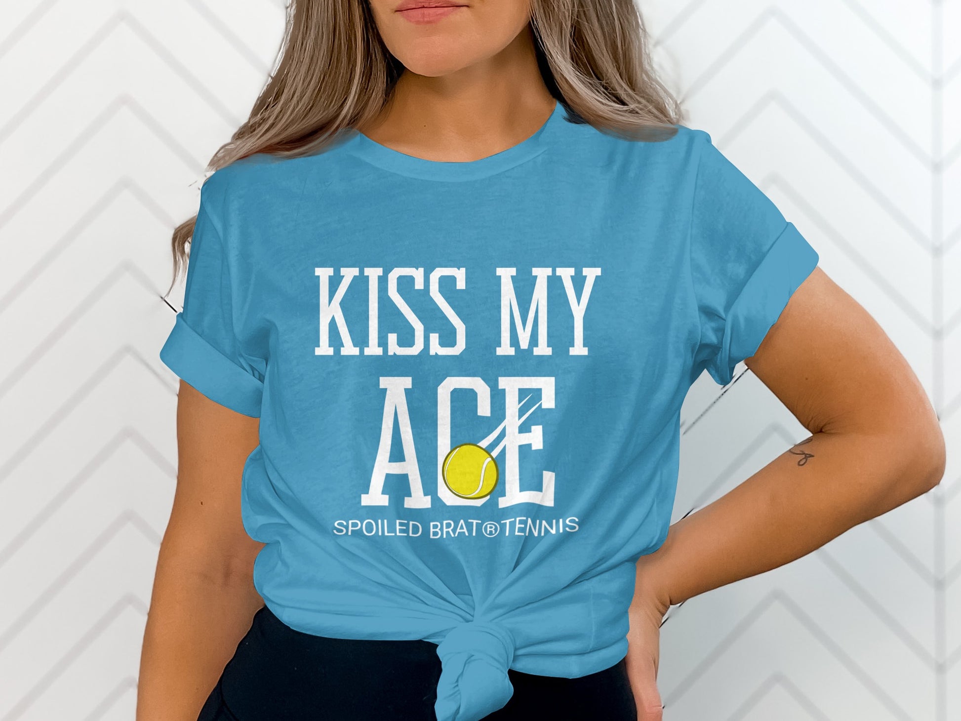 Blue t-shirt with "KISS MY ACE" and tennis ball graphic.