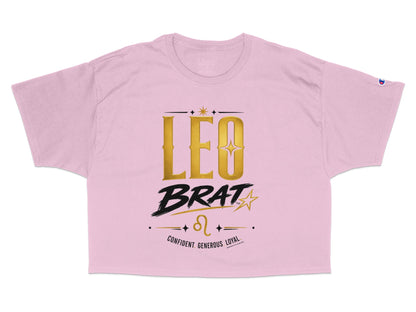 Pink t-shirt with gold "LEO BRAT" text, Leo zodiac symbol, and descriptors.