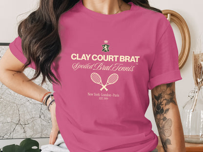 Pink t-shirt with "Clay Court Brat Spoiled Brat Tennis" text and tennis rackets.