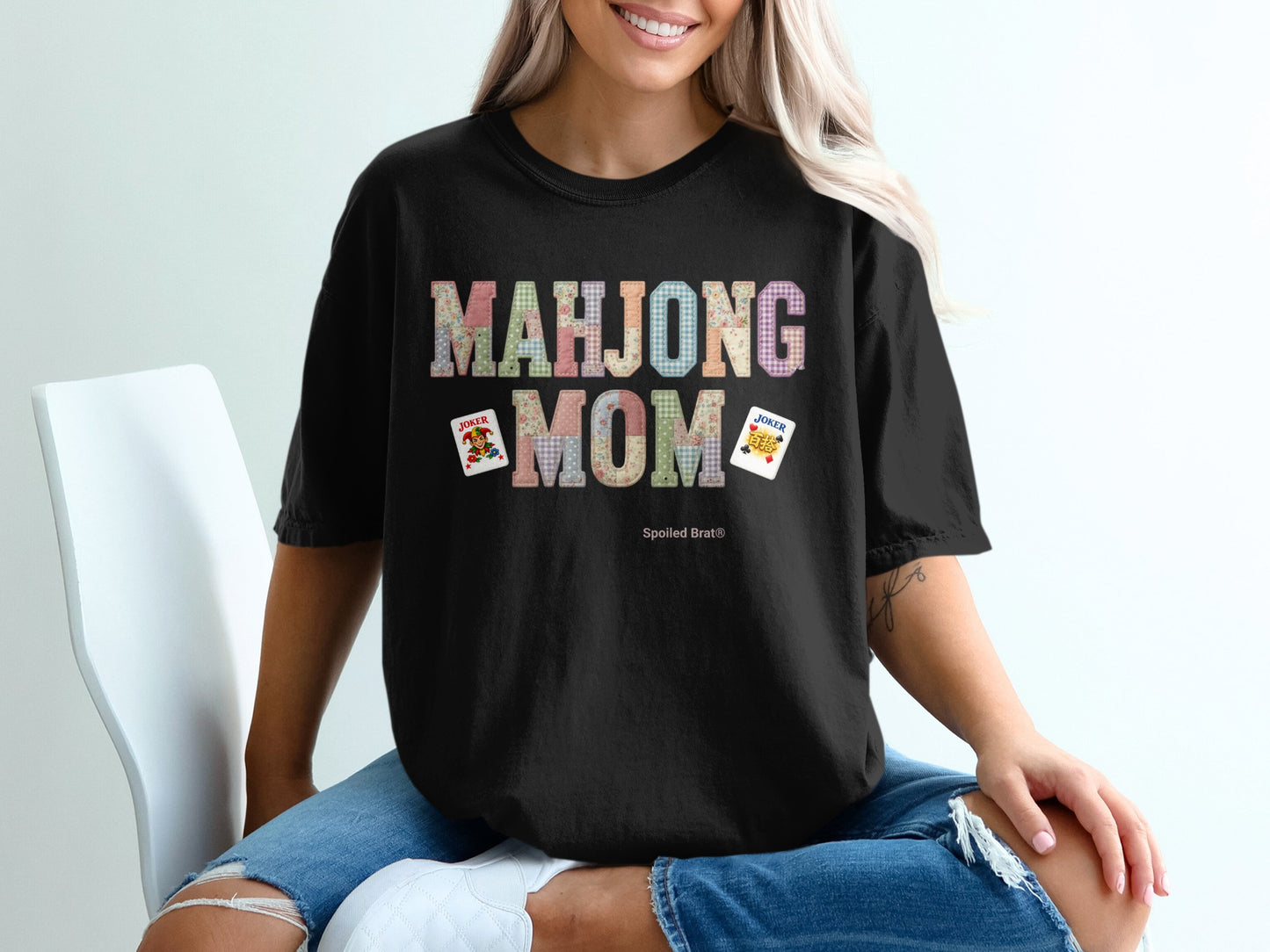 Black t-shirt with "Mahjong Mom" text and Joker cards.