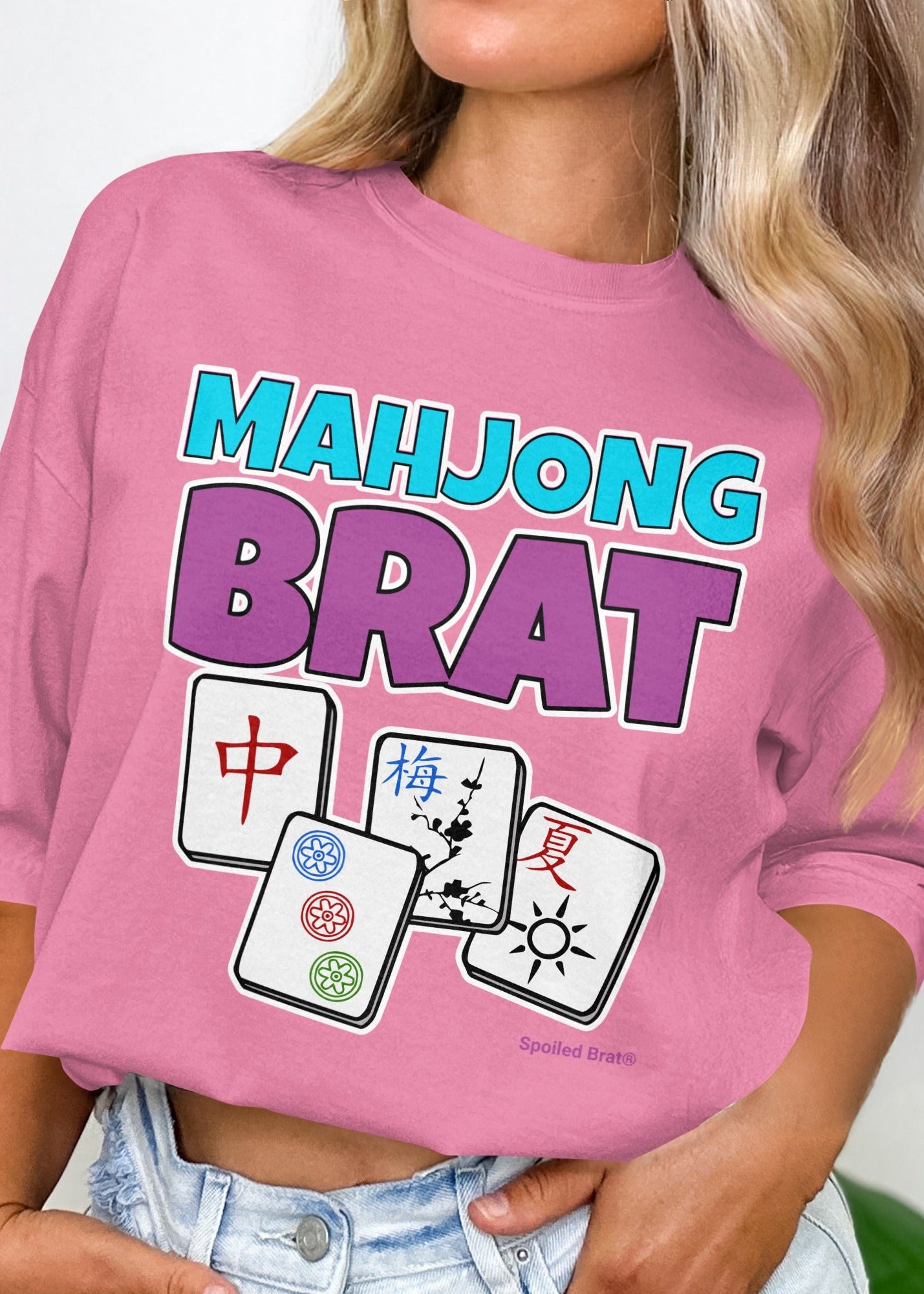 Pink t-shirt with "Mahjong Brat" and three Mahjong tiles.