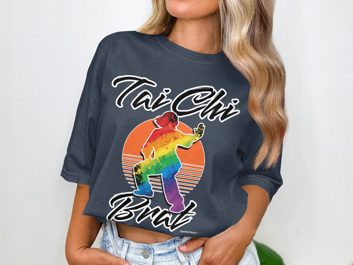 Tai Chi Bratz graphic t-shirt with rainbow silhouette in front of a sunset.
