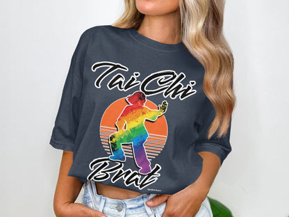 Tai Chi Bratz graphic t-shirt with rainbow silhouette in front of a sunset.
