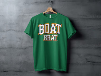 Green t-shirt with white and gold "BOAT BRAT" text centered on the chest.