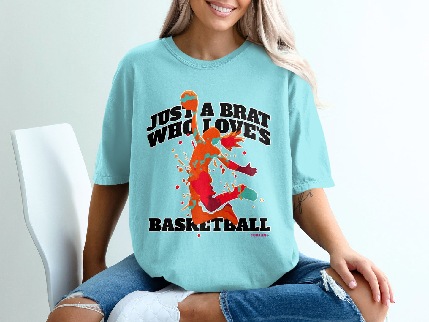Light blue t-shirt with a basketball player graphic and text.