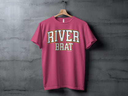 Pink t-shirt with "RIVER BRAT" text in collegiate block lettering.
