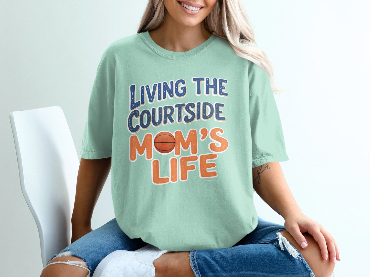 Mint t-shirt with "Living the Courtside Mom's Life" text and basketball graphic.