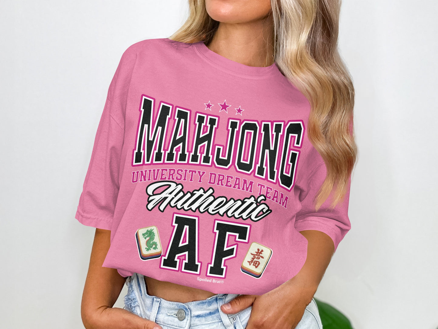 Pink t-shirt with "Mahjong University Dream Team Authentic AF" and mahjong tiles.