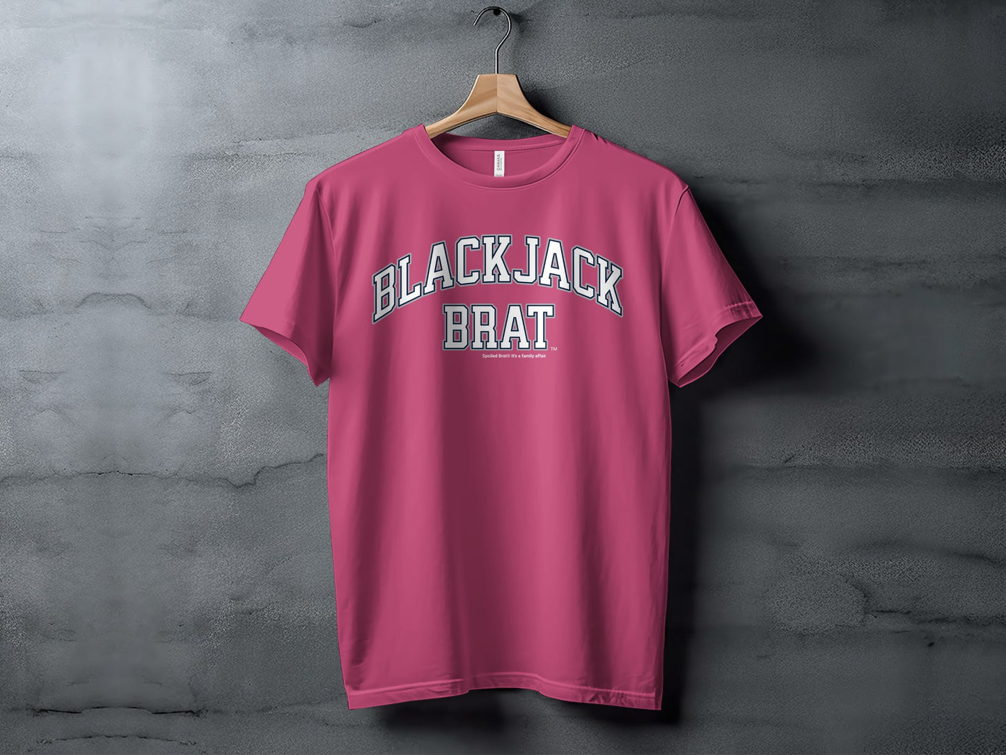 Pink t-shirt with "BLACKJACK BRAT" text and smaller text below.