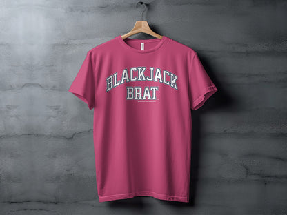 Pink t-shirt with "BLACKJACK BRAT" text and smaller text below.