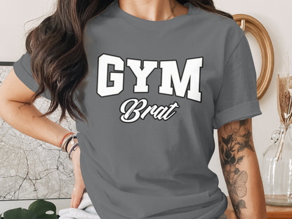 Gray t-shirt with white and black text reading "GYM Brat".