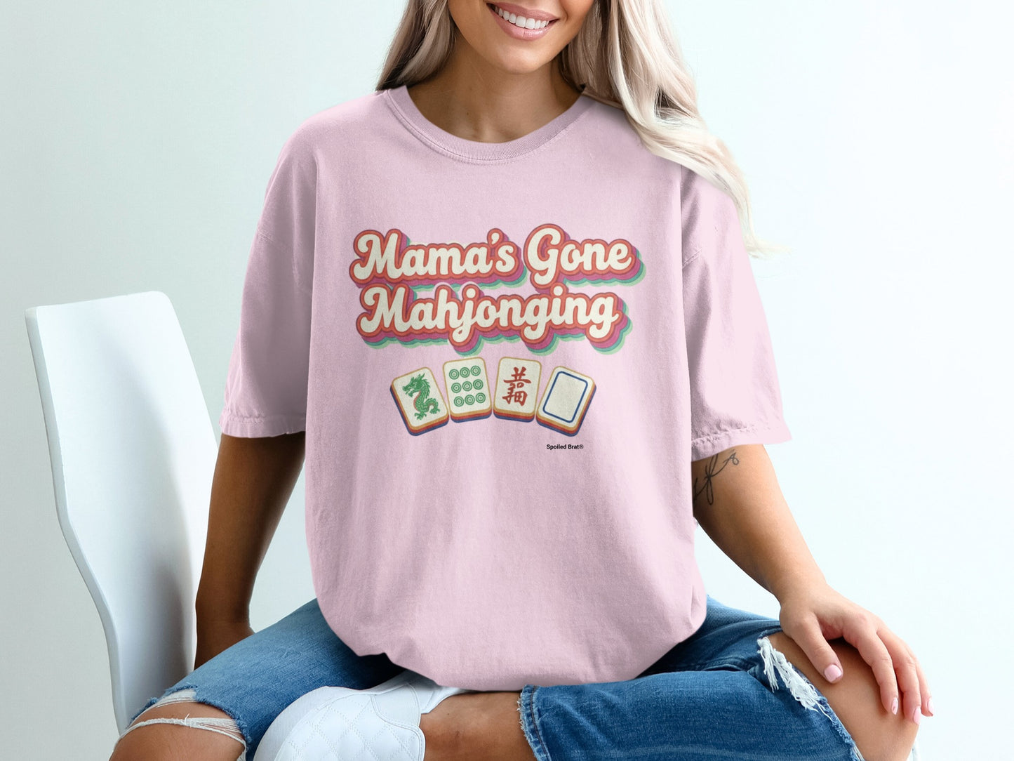 Pink t-shirt with "Mama's Gone Mahjonging" in retro lettering.