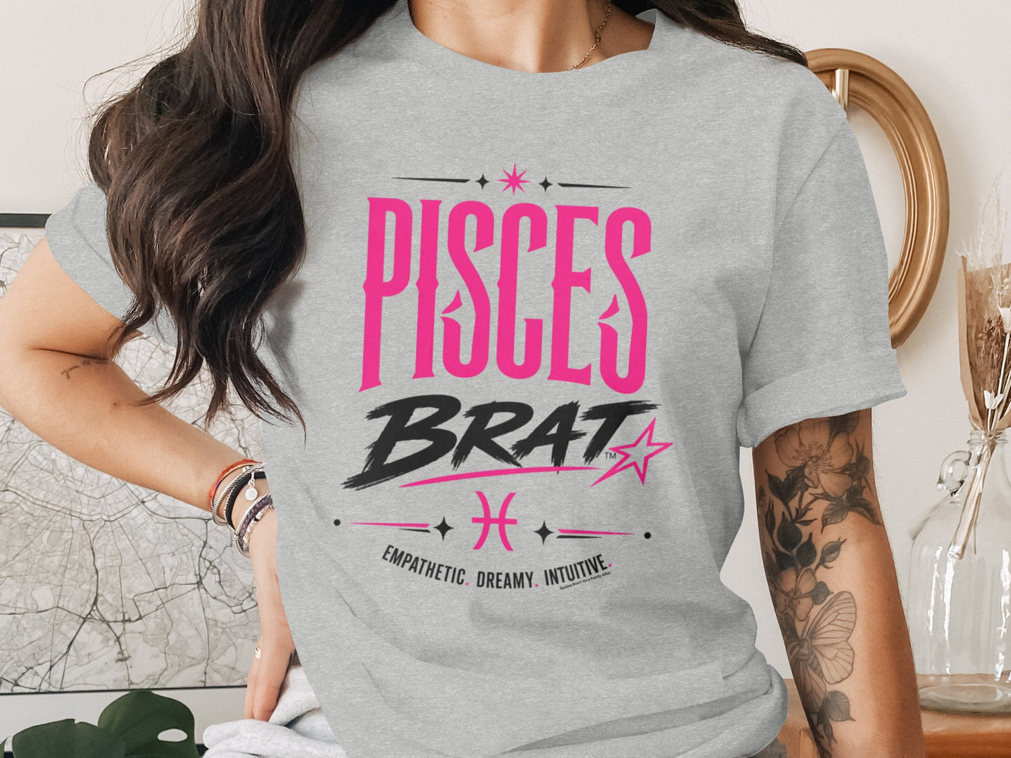Grey t-shirt with "PISCES BRAT" graphic and zodiac sign.