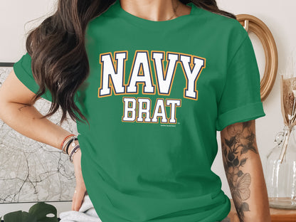 Green t-shirt with "NAVY BRAT" text in white with blue and yellow trim.