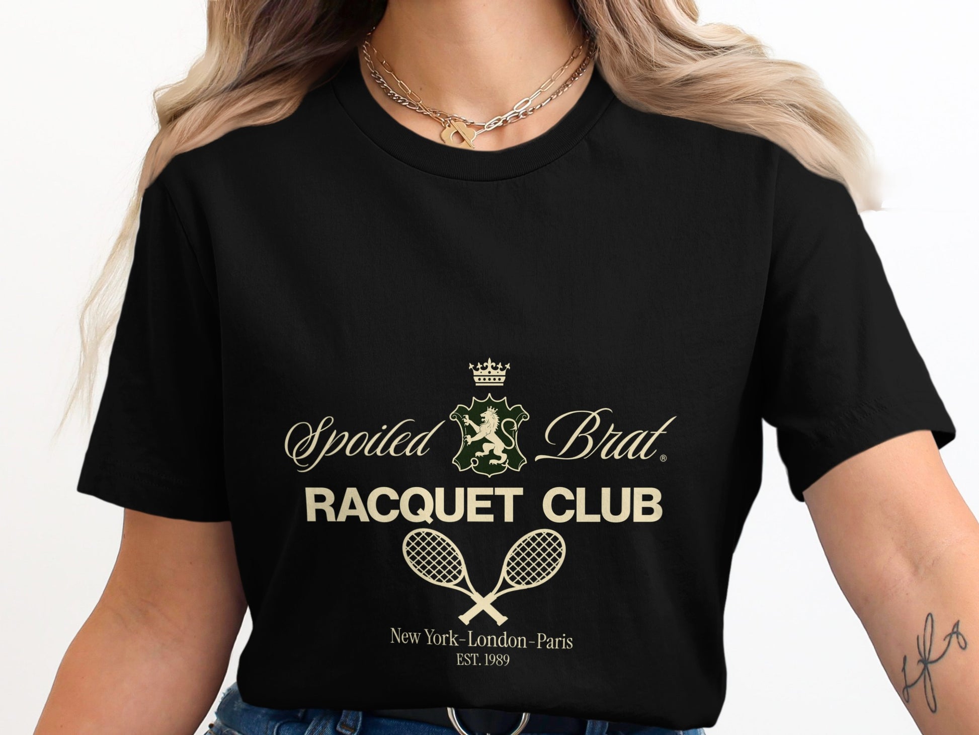 Black t-shirt with "Spoiled Brat Racquet Club" text and crossed tennis rackets.
