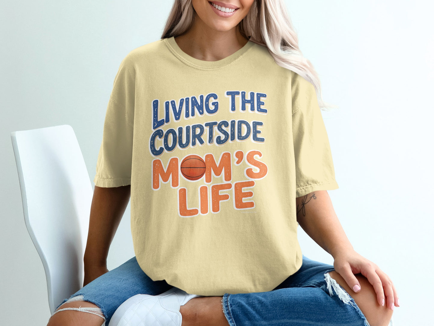 T-shirt with "Living the courtside mom's life" and basketball graphic.
