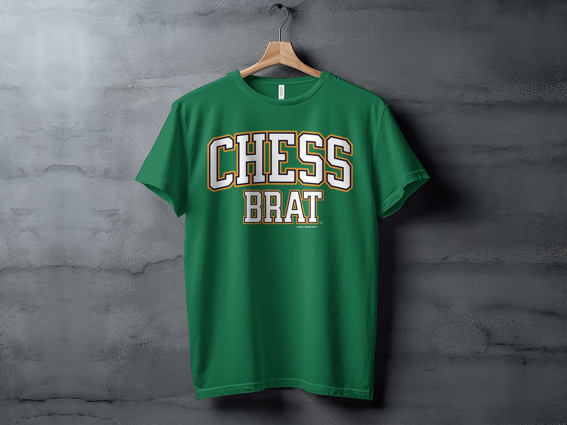 Green t-shirt with bold white text "CHESS BRAT" and "Another Spoiled Brat" logo.