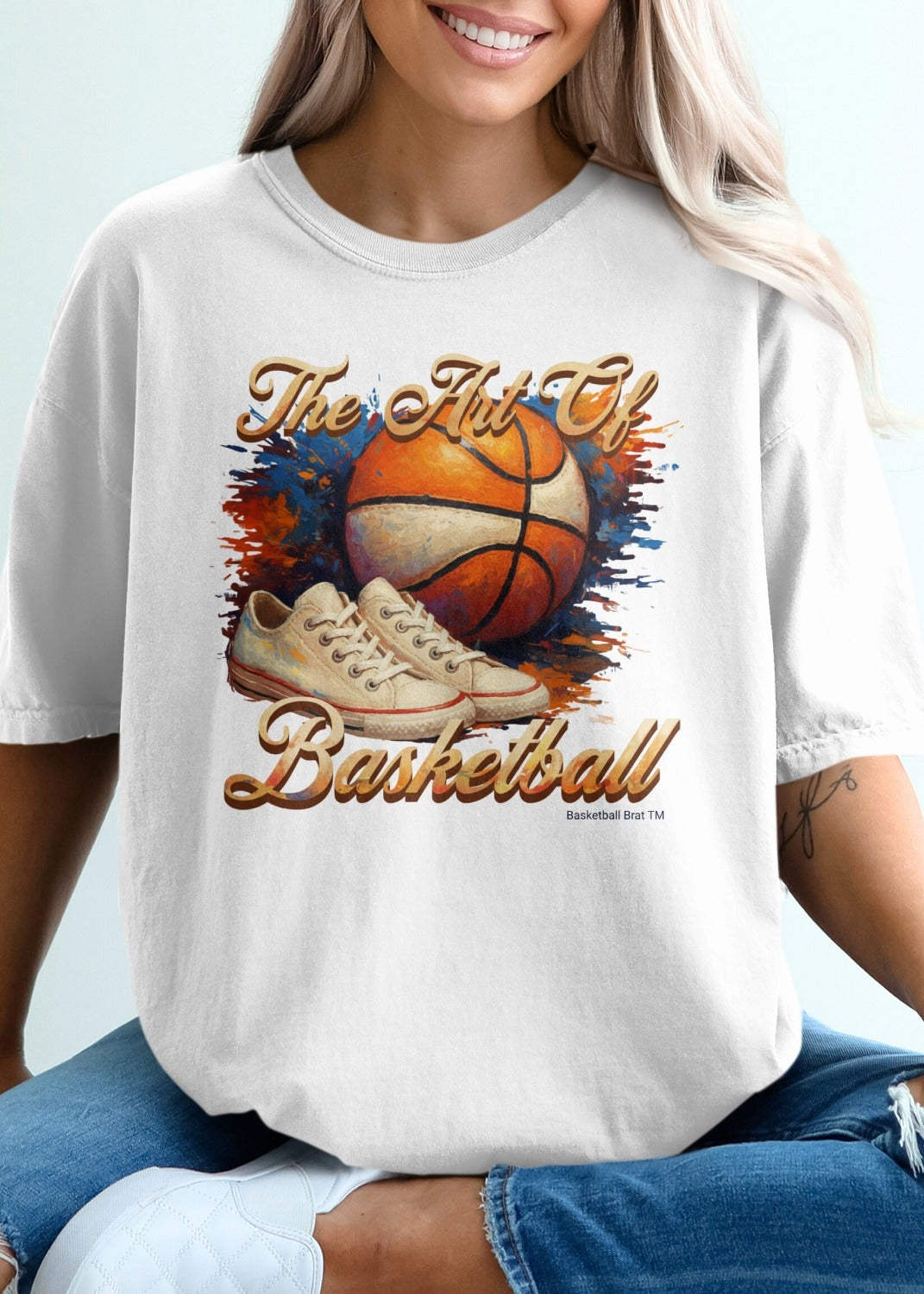 Basketball t-shirt with graphic of basketball and sneakers.