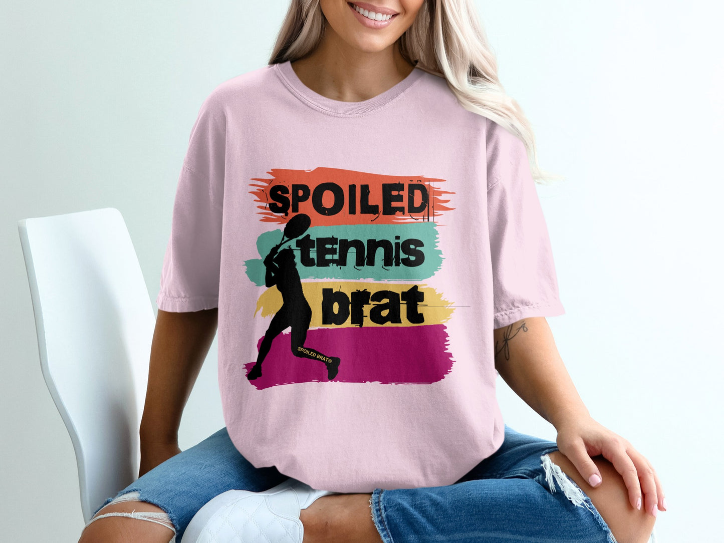 Pink t-shirt with "Spoiled Tennis Brat" text and tennis player silhouette.