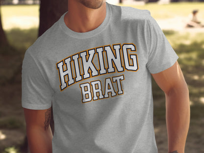 Grey t-shirt with white and orange "HIKING BRAT" text.