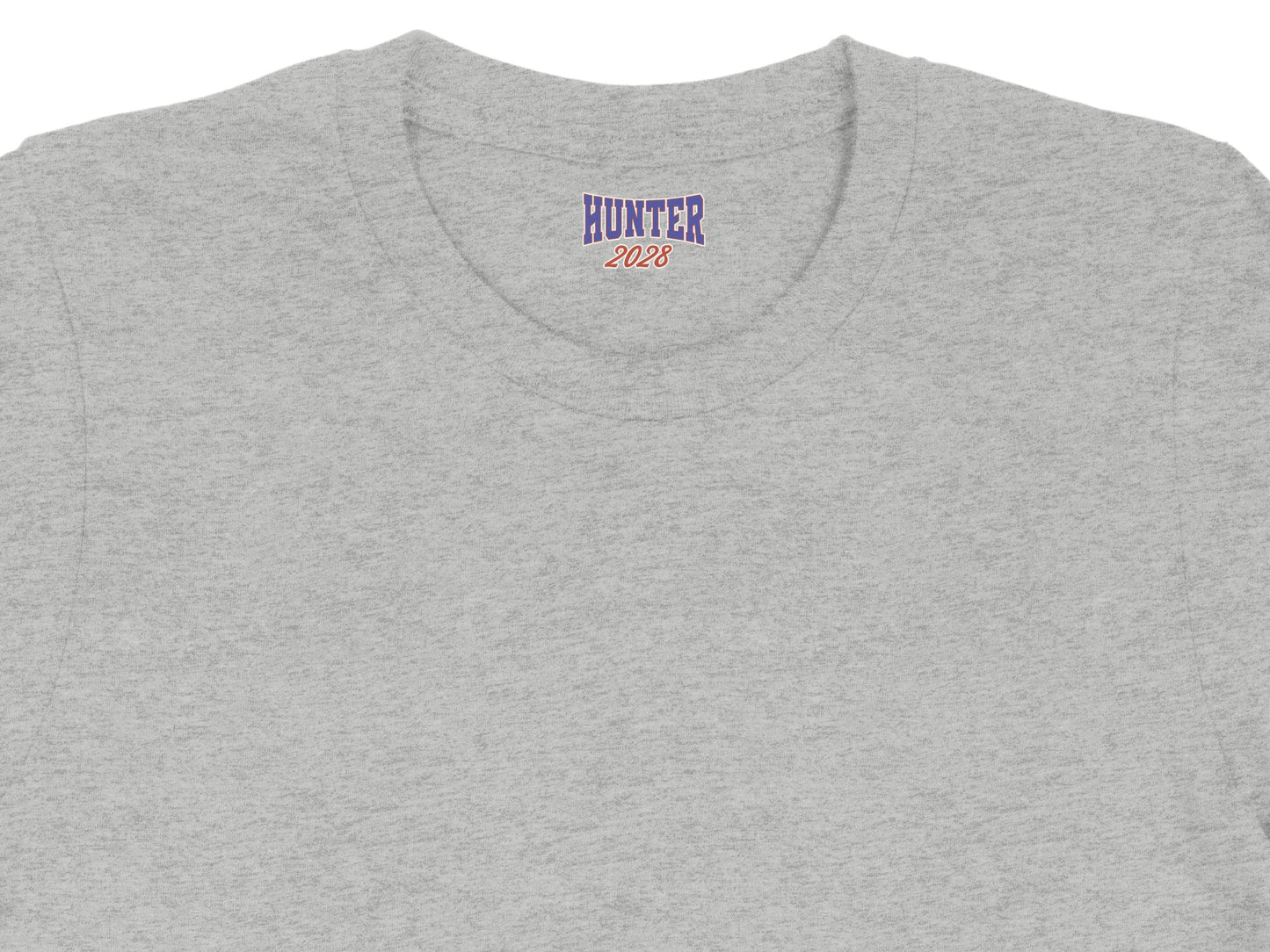 Grey t-shirt collar with blue and red "HUNTER 2028" graphic.