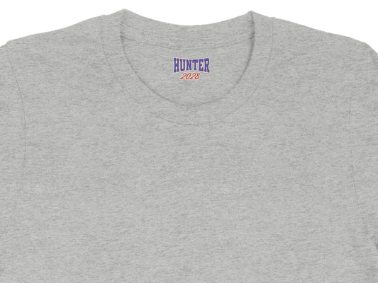 Grey t-shirt collar with blue and red "HUNTER 2028" graphic.