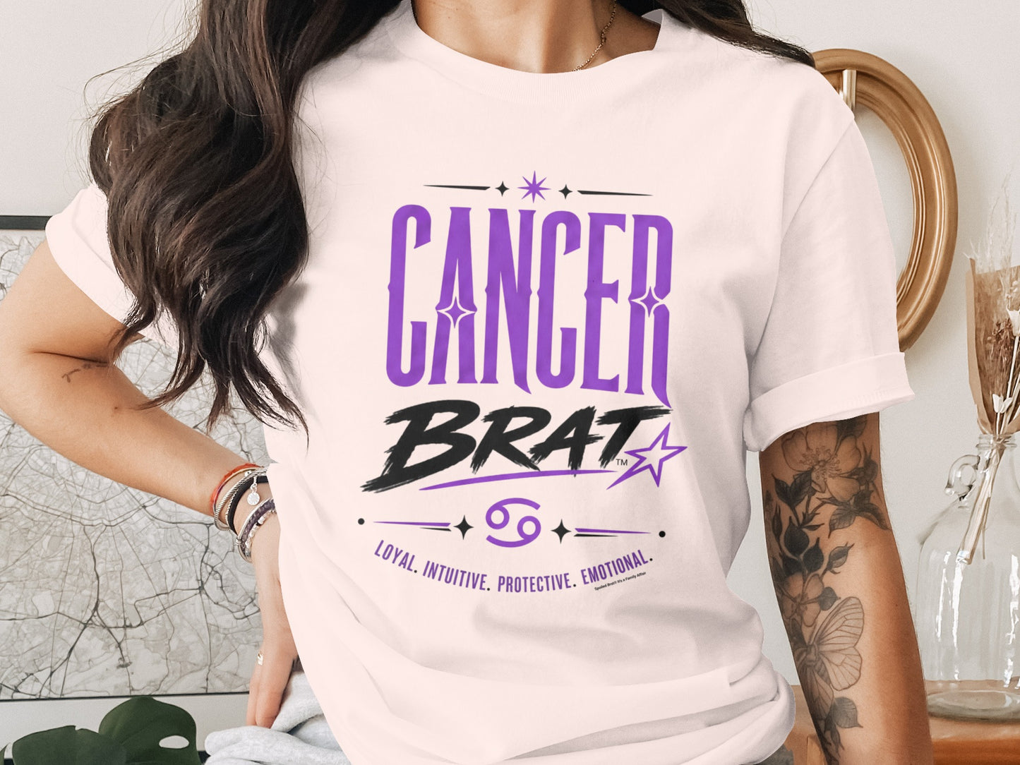 White t-shirt with "CANCER BRAT", zodiac symbol, and traits: loyal, intuitive, protective, emotional.