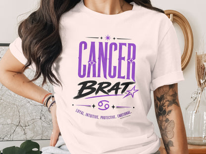 White t-shirt with "CANCER BRAT", zodiac symbol, and traits: loyal, intuitive, protective, emotional.